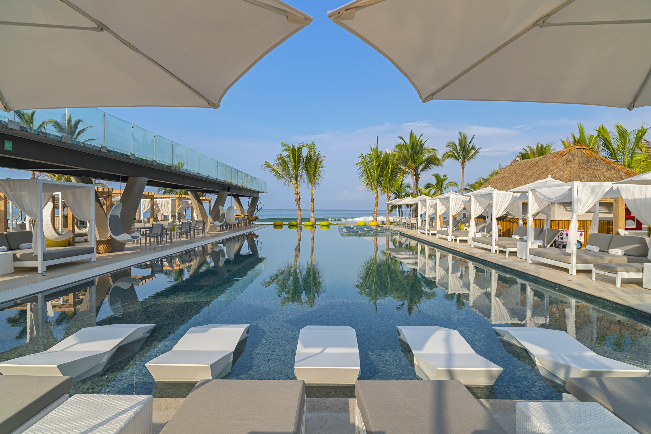 Jump into the vibrant scene at WET®, which features an oceanfront infinity pool.
